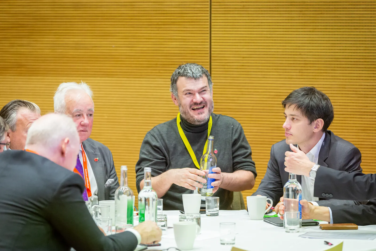 Craig Fearn in discussion with directors around a boardroom table at an Institute of Directors session